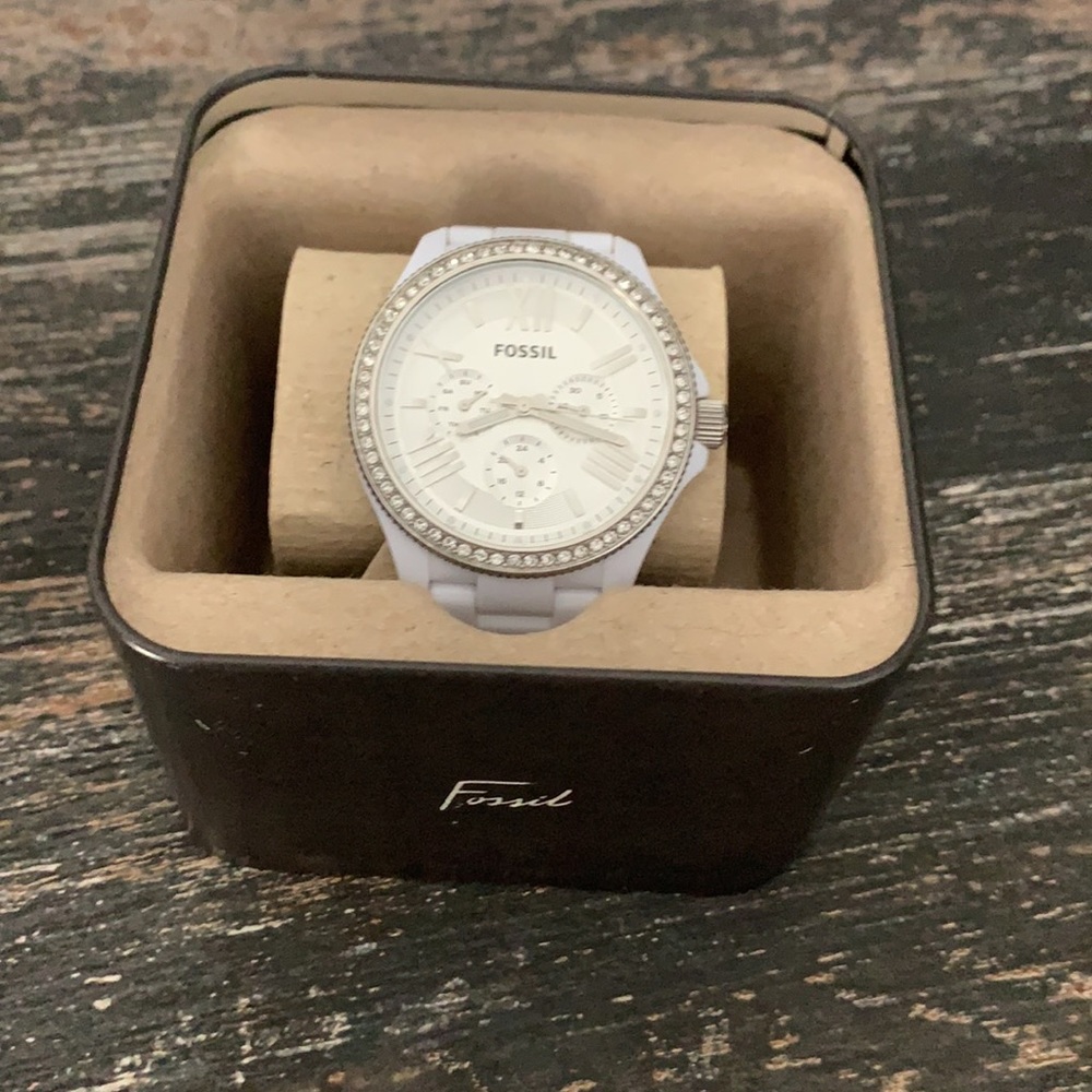 Fossil watch with links and gems face.